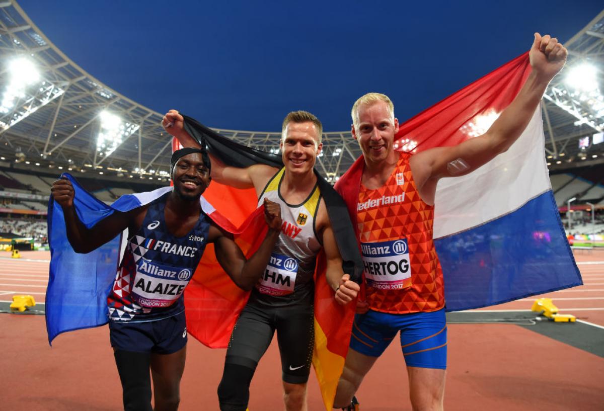 Markus Rehm - London 2017 three men celebrate with the flags of their countries