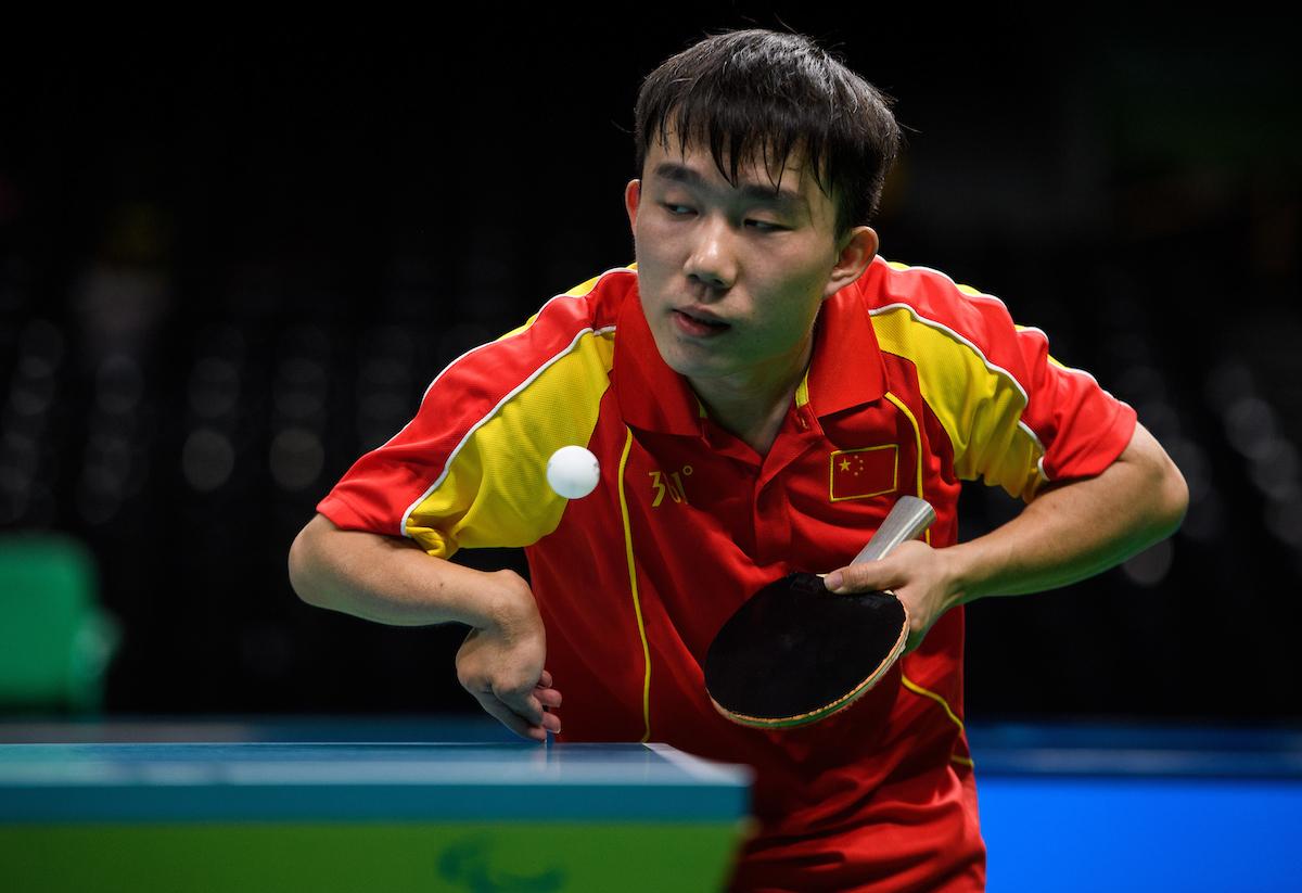 a Para table tennis player goes for a shot