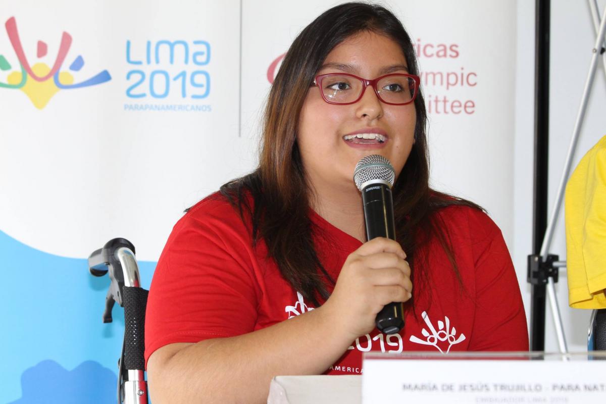 a Para swimmer speaks into a microphone