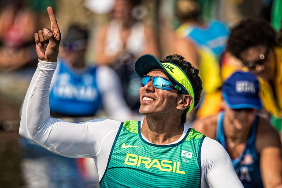 Luis Cardoso da Silva a Para caoneist celebrates by raising his arms in the air