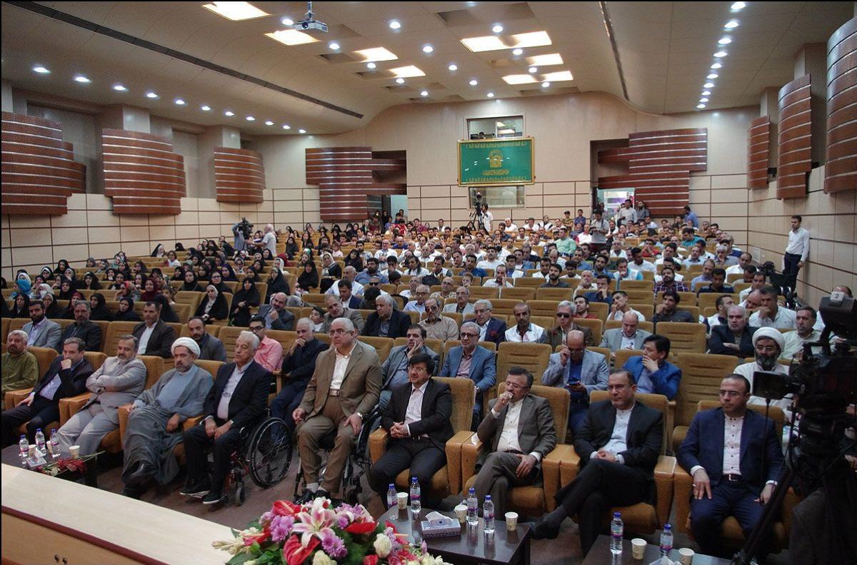 a group of Para athletes seated in an auditorium