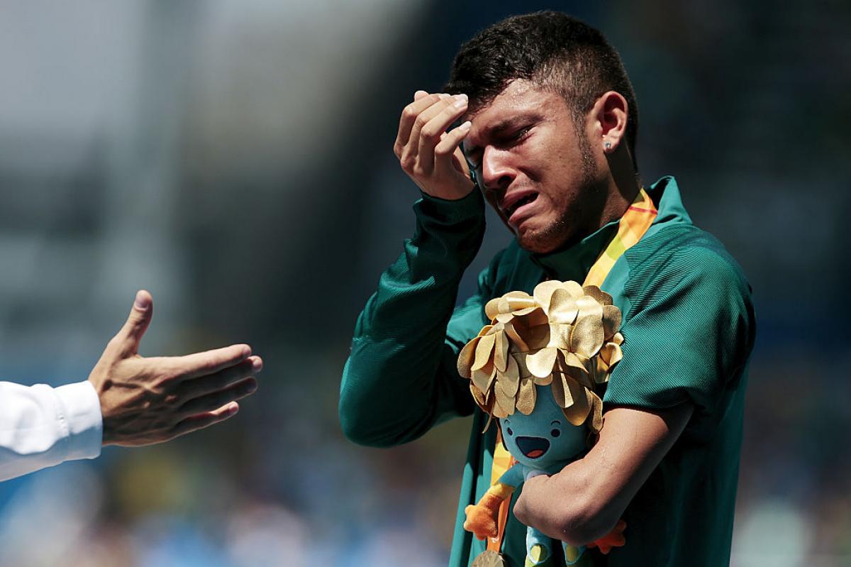 a Para athlete cries on the podium