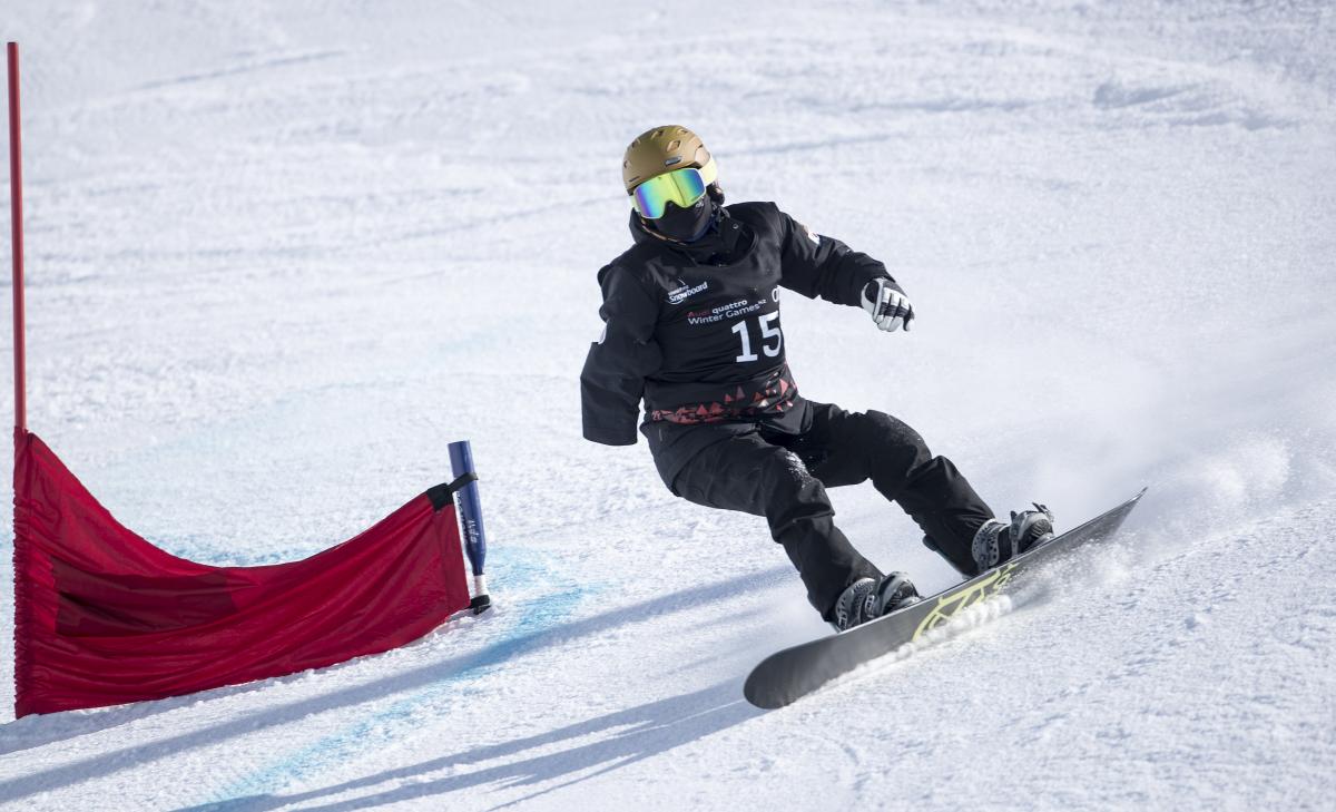 a Para snowboarder goes down a slope