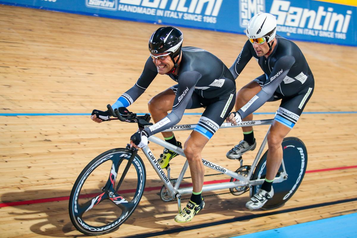 Pierre Amighini and Stefano Cecini a Para cycling tandem go round the track