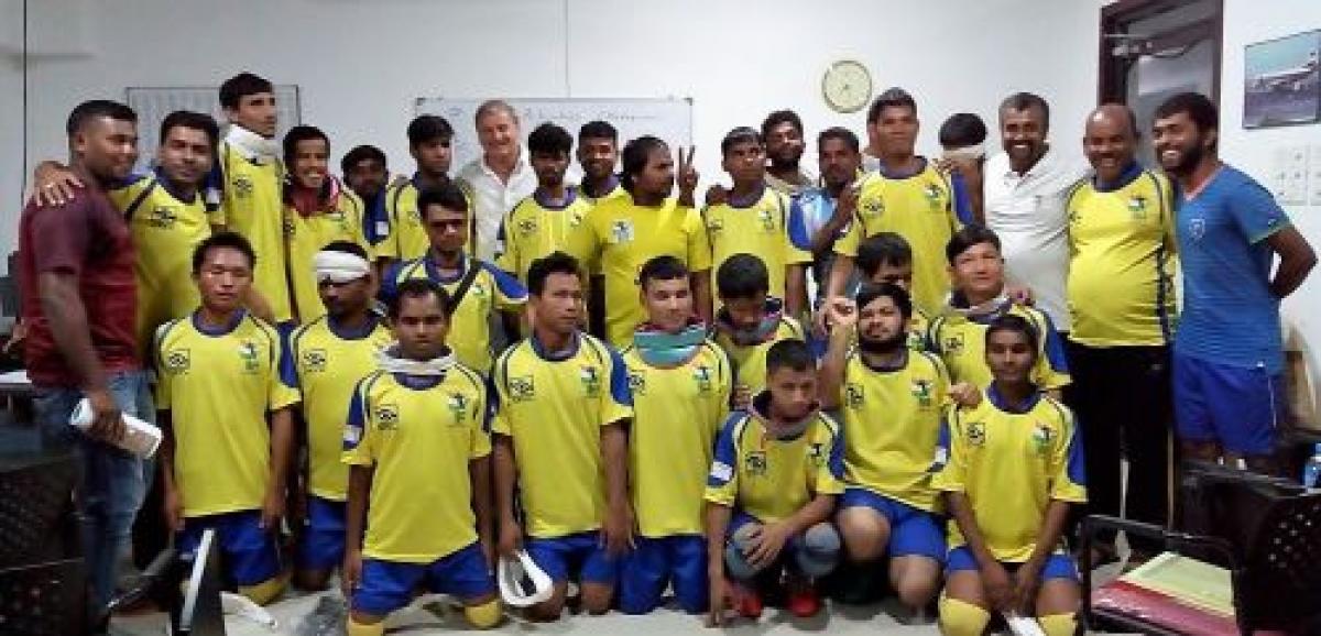 India blind football academy a group of visually impaired athletes smile for the camera