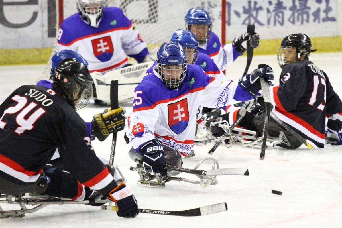 a group of Para ice hockey players on the ice