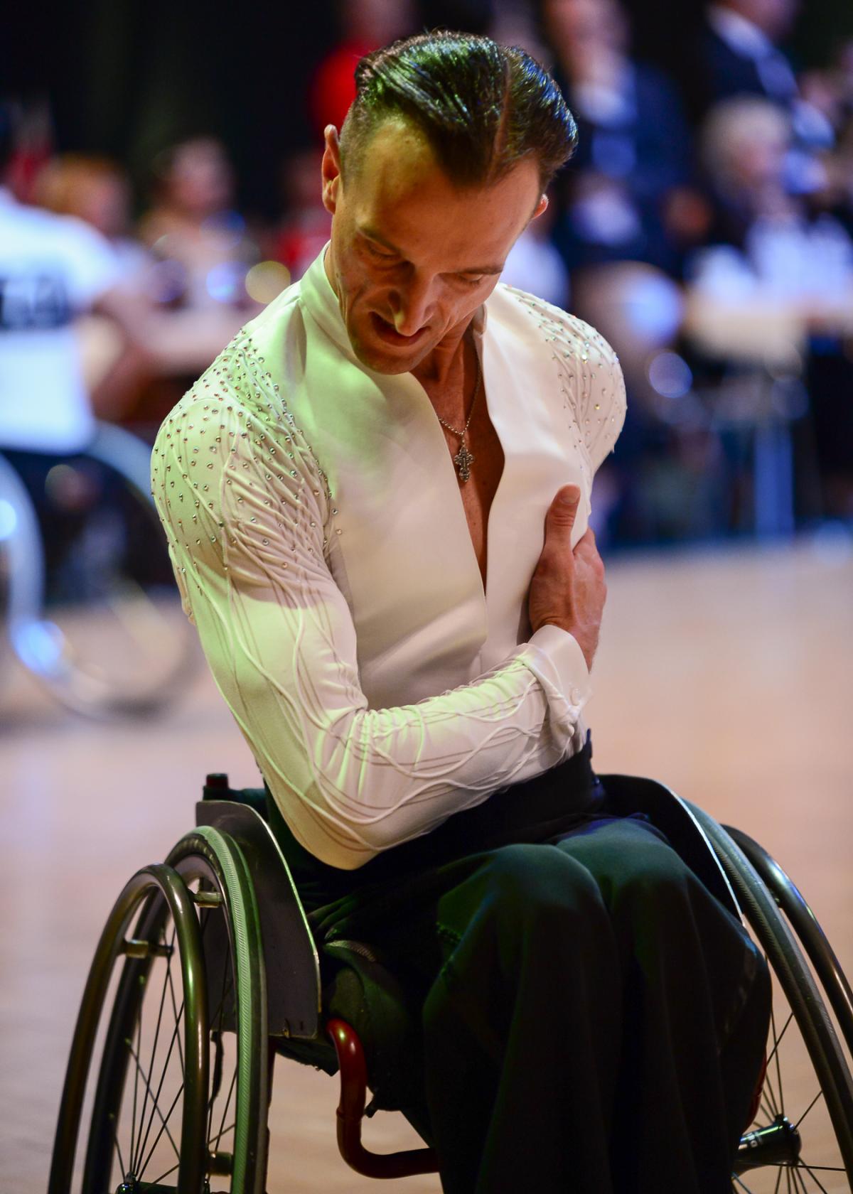 Male wheelchair dancer bows