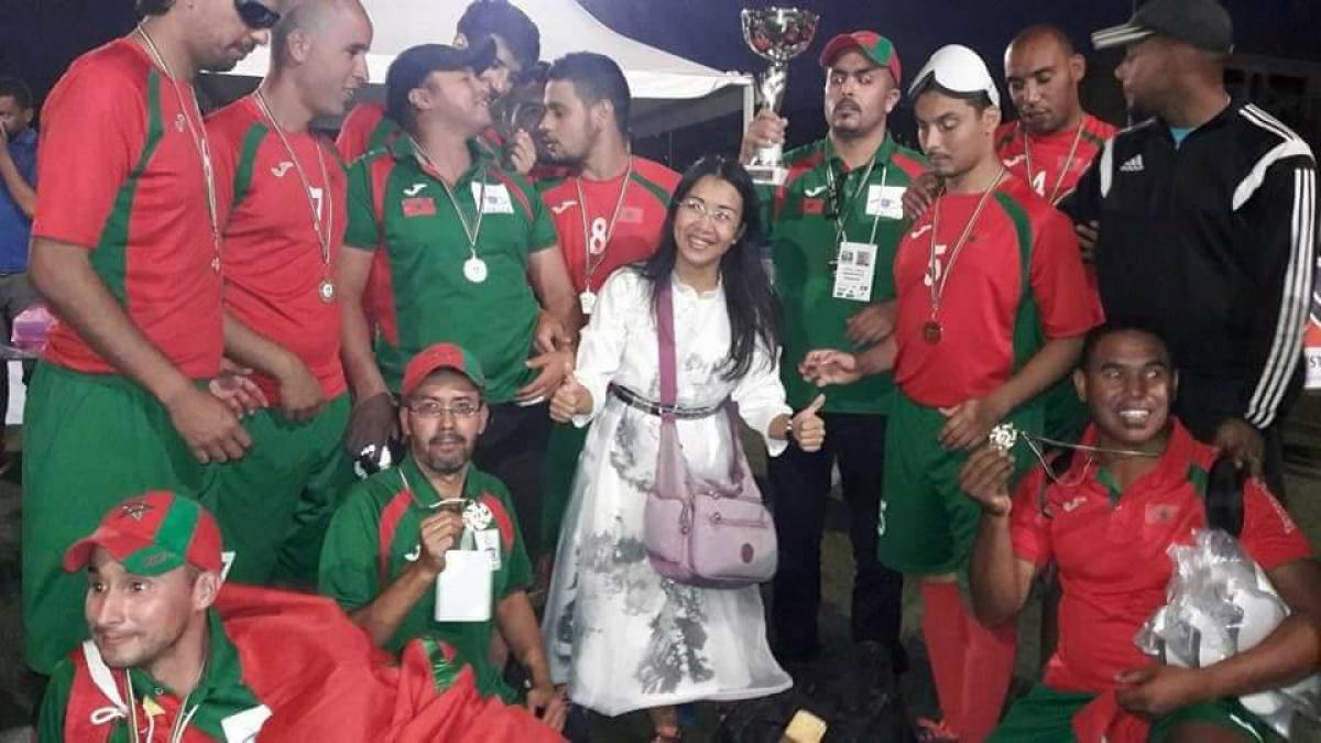 a group of blind footballers celebrate their win