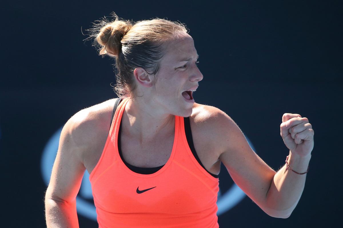 Jiske Griffioen a female Para wheelchair tennis player gives a celebratory fist pump