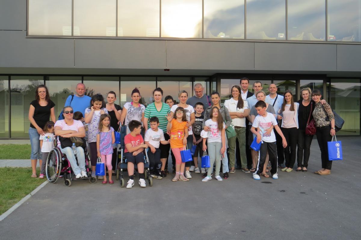 NPC Croatia 'Wholehearted coaches' project a group of adults and children smile for the camera