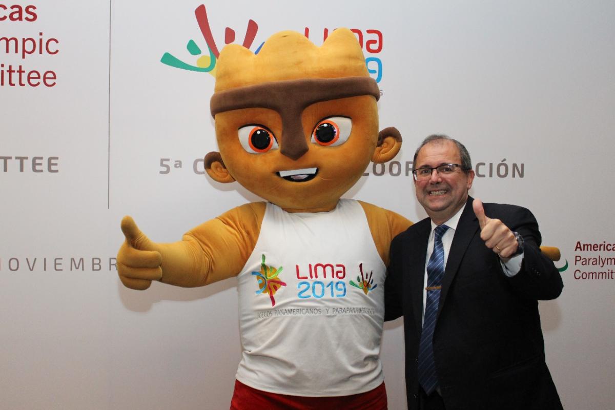 Lima 2019 visit Xavi Gonzalez A cuddly mascot and a man give a thumbs up to the camera