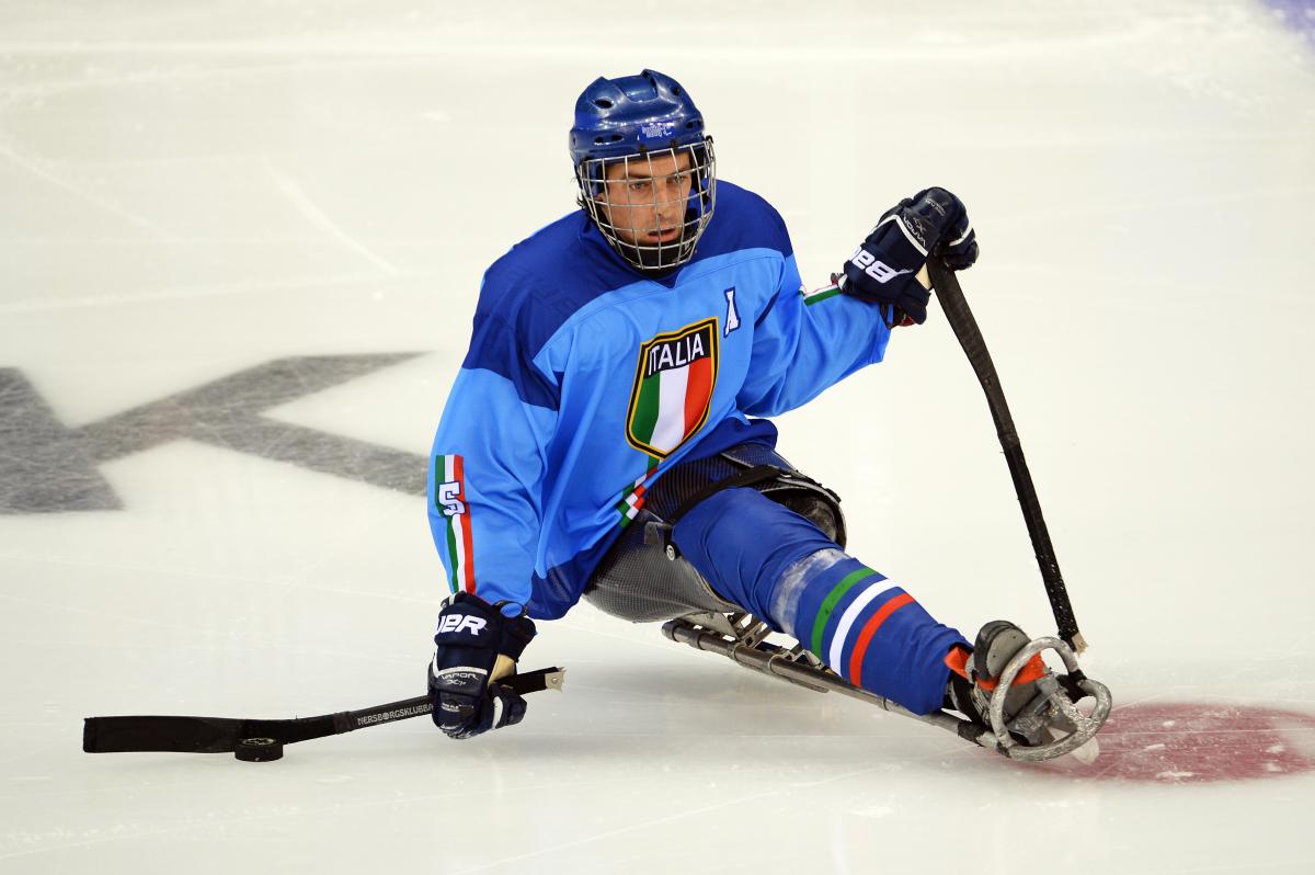 a male Para ice hockey player on the ice