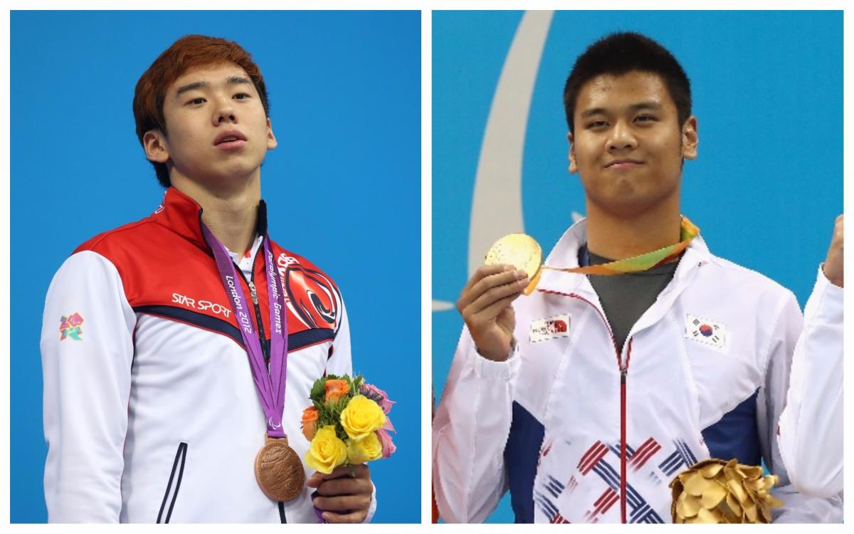 two male Para swimmers stand on the podium with their medals