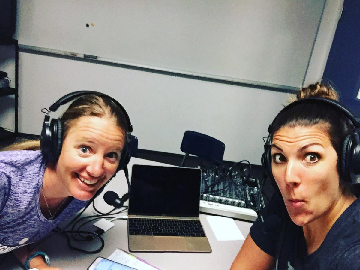 two women take a selfie in a studio