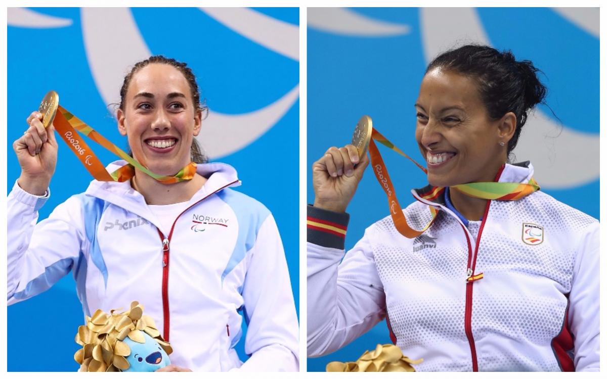 two female Para swimmers hold up their gold medals