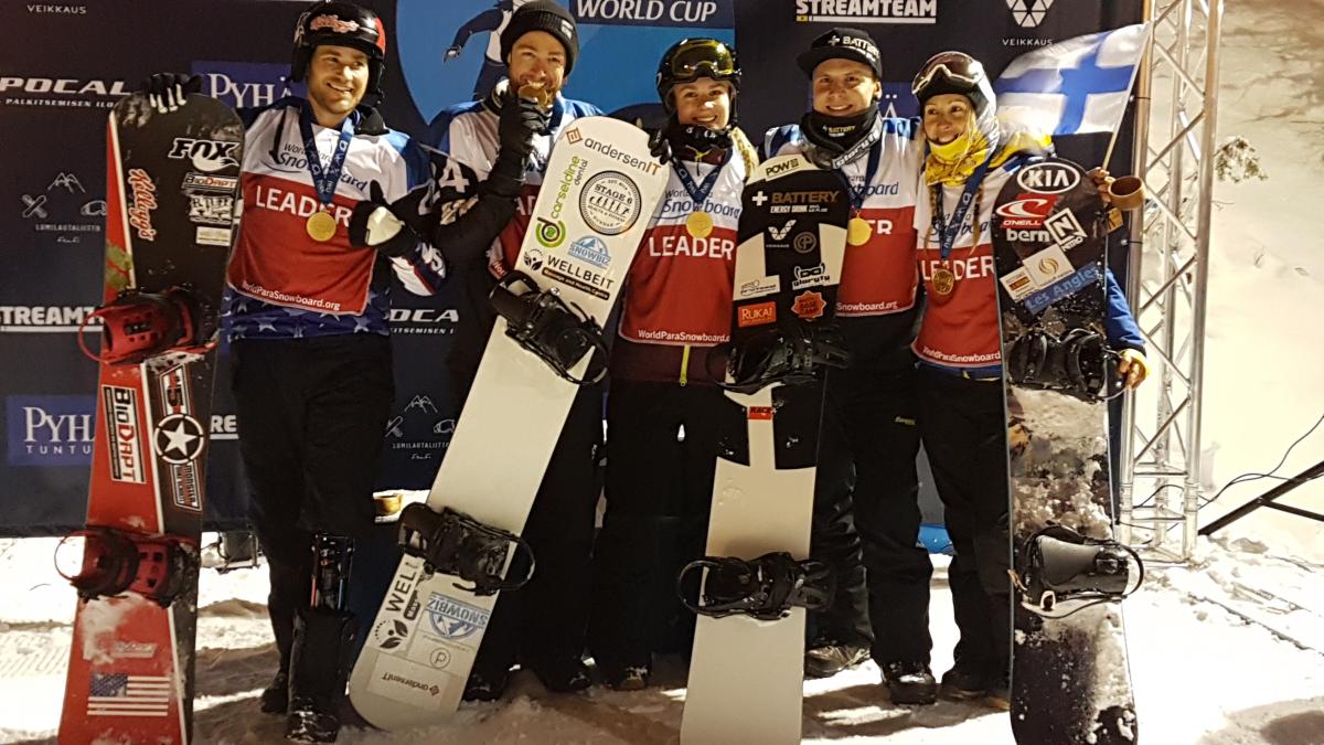 Pyha Snowboard World Cup Day 1 winners a group of Para snowboarders smile with their medals