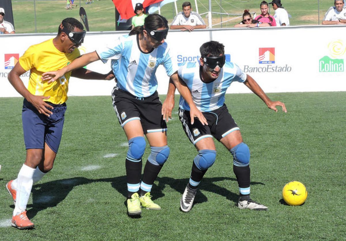 Men fighting for a football