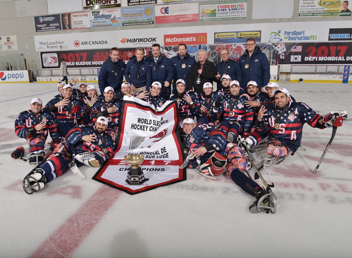 USA win 2017 Ice Sledge Hockey Challenge A group of Para ice hockey players pose with their trophy on the ice