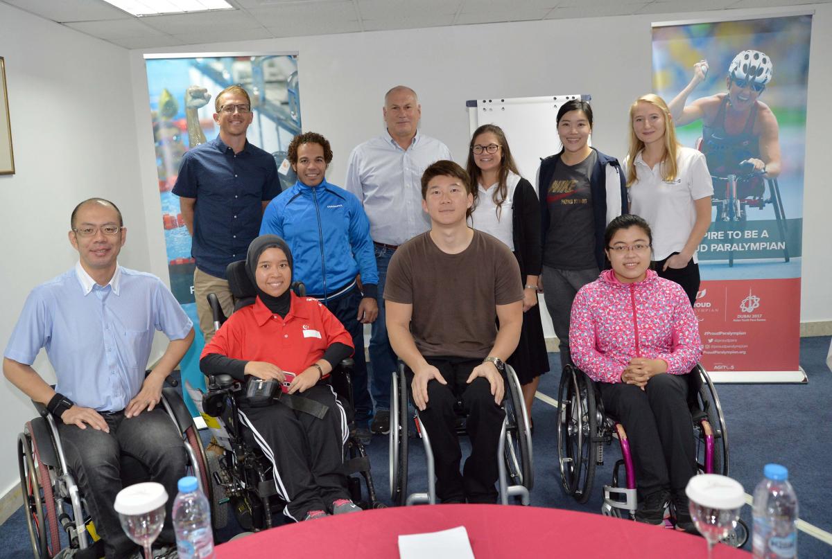 Seven new Proud Paralympian leaders pose with the workshop educators in Dubai