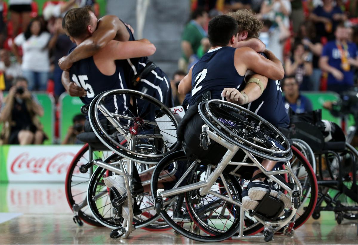 USA wheelchair basketball - Rio 2016 male wheelchair basketball players hug eachother on the court