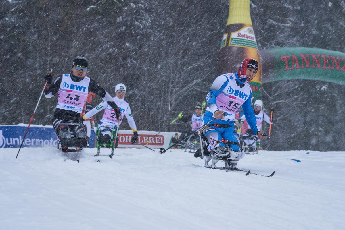 Cross-country men's sitting - Oberried 2018 a group of male sit skiers race on the snow