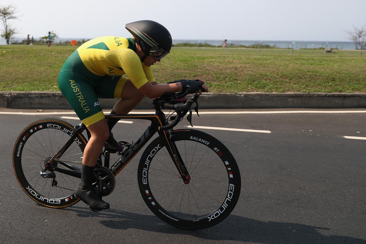 a female Para cyclist on the road