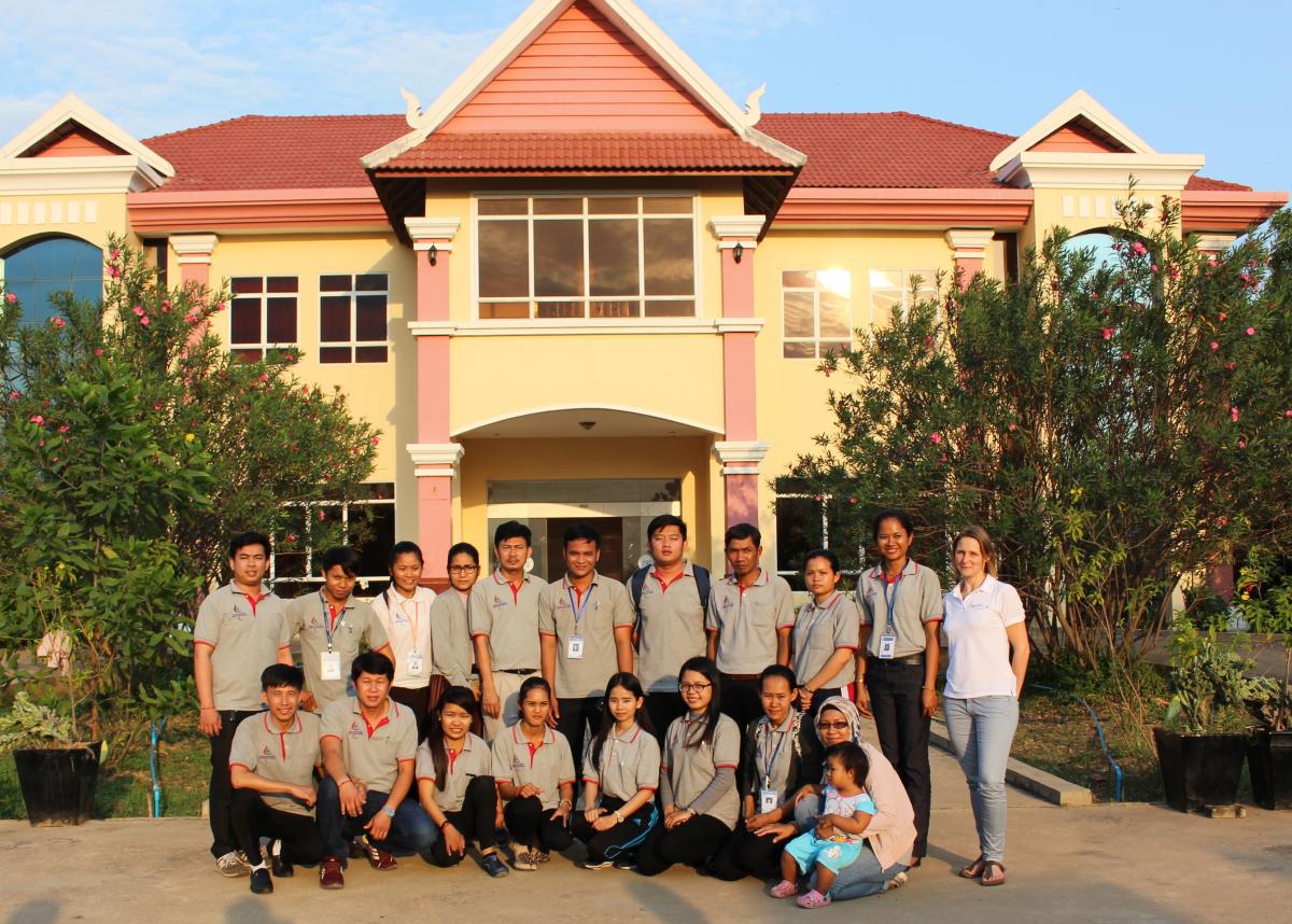 Members of NPC Cambodia and Agitos Foundation staff pose for picture in front of NPC headquarters in Phnom Penh