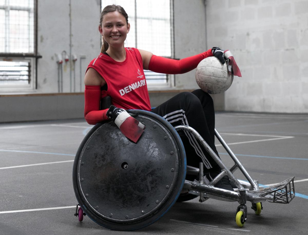 Sofie Skoubo - Denmark a female wheelchair rugby player poses with the ball