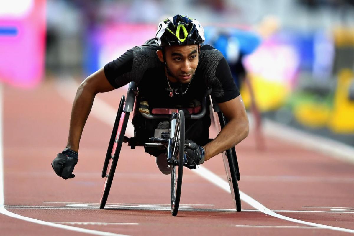 Walid Ktila of Tunisia crosses the line to win the Mens 200m T34 final at the London World Para Athletics Championships.