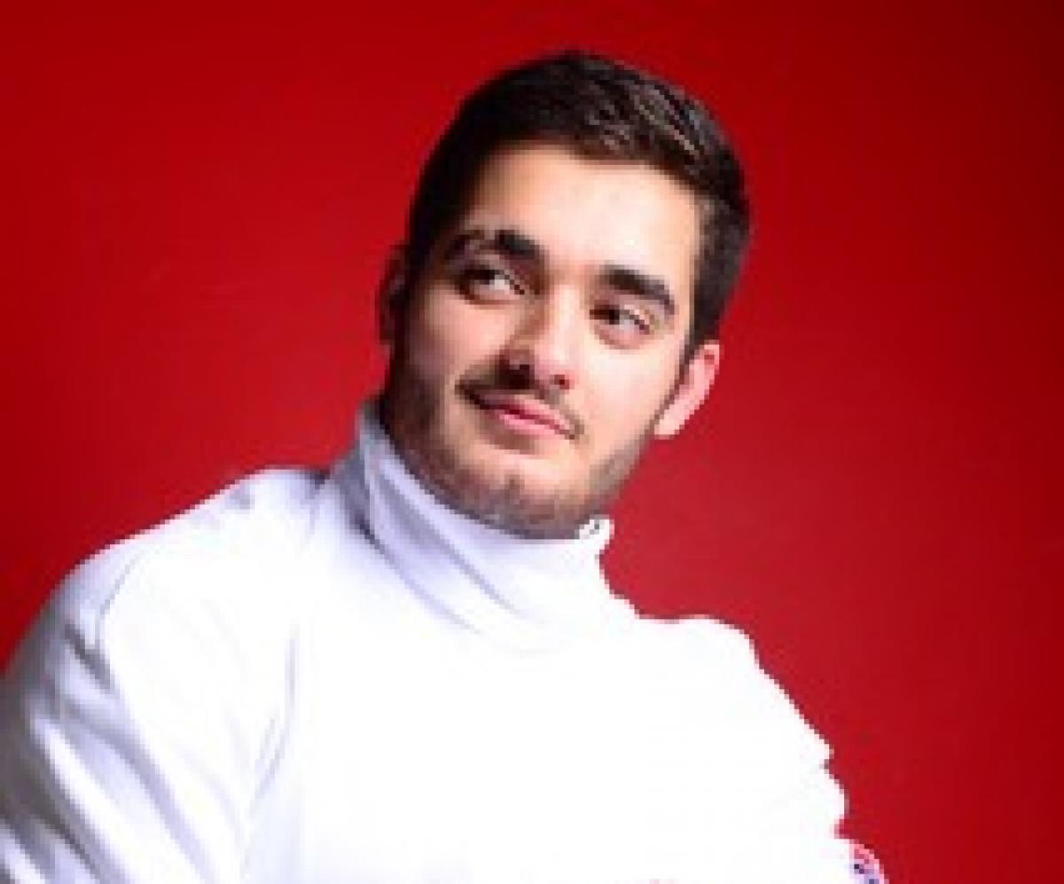 Dimitri Coutya - wheelchair fencing Portrait of wheelchair fencer with helmet off