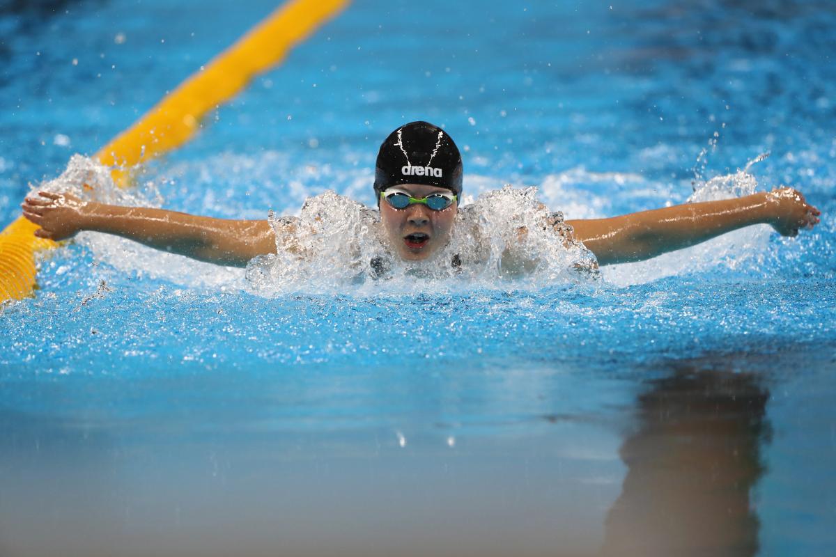 Liesette Bruinsma a female Para swimmer mid-butterfly stroke