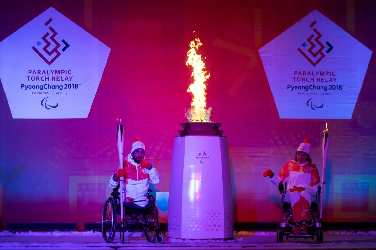 PyeongChang 2018 Heritage Flame lighting two athletes light a flame