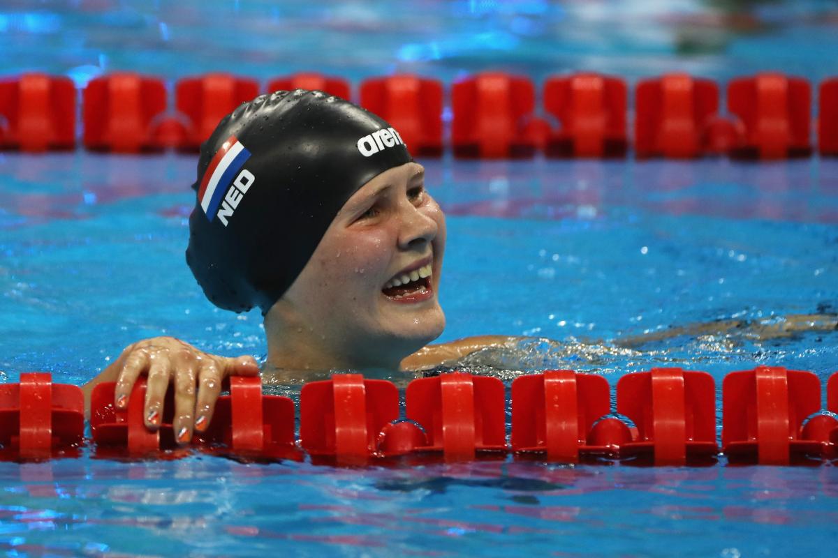 Liesette Bruinsma a female Para swimmer smiles in the pool