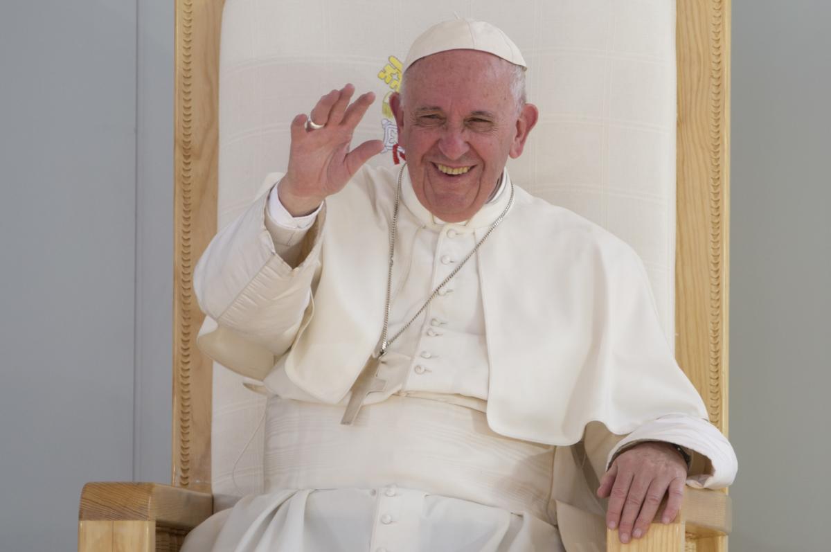 The Pope laughing his chair