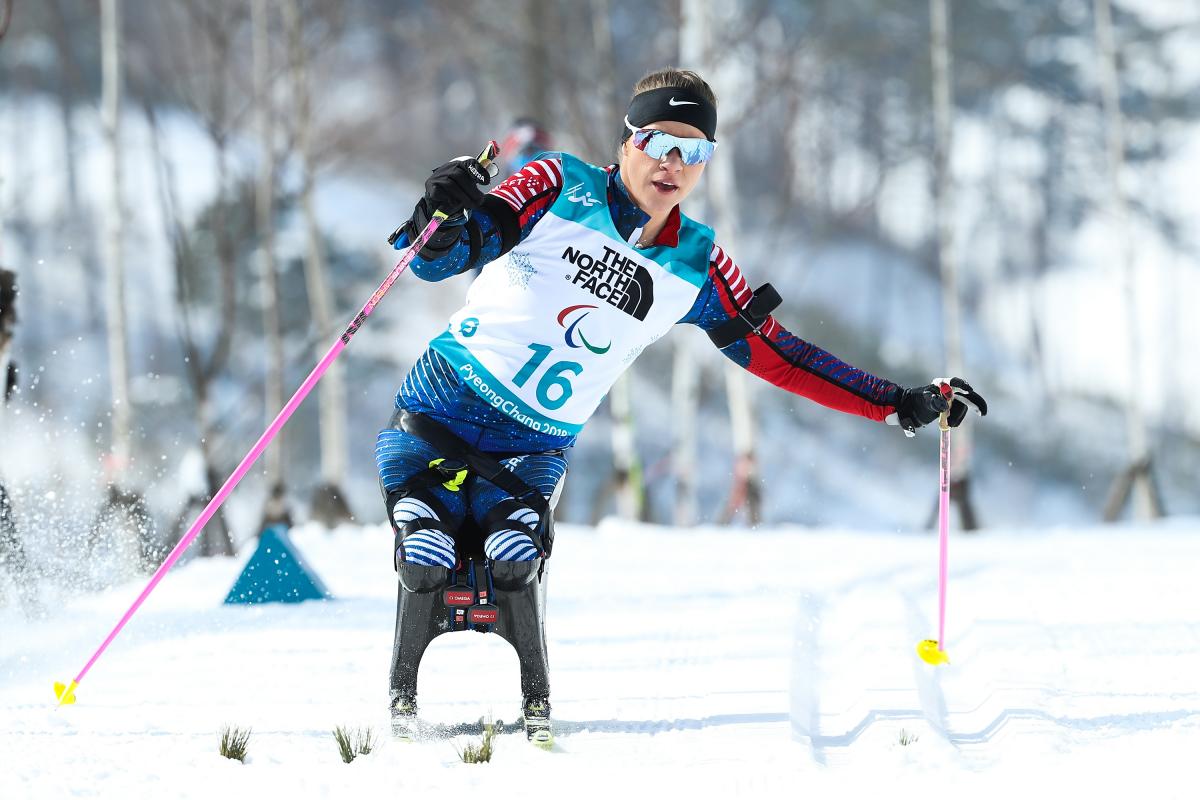 a female sit skier in action