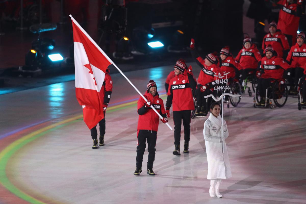 Brian McKeever - PyeongChang 2018 a male Para athlete carrying the Canadian flag