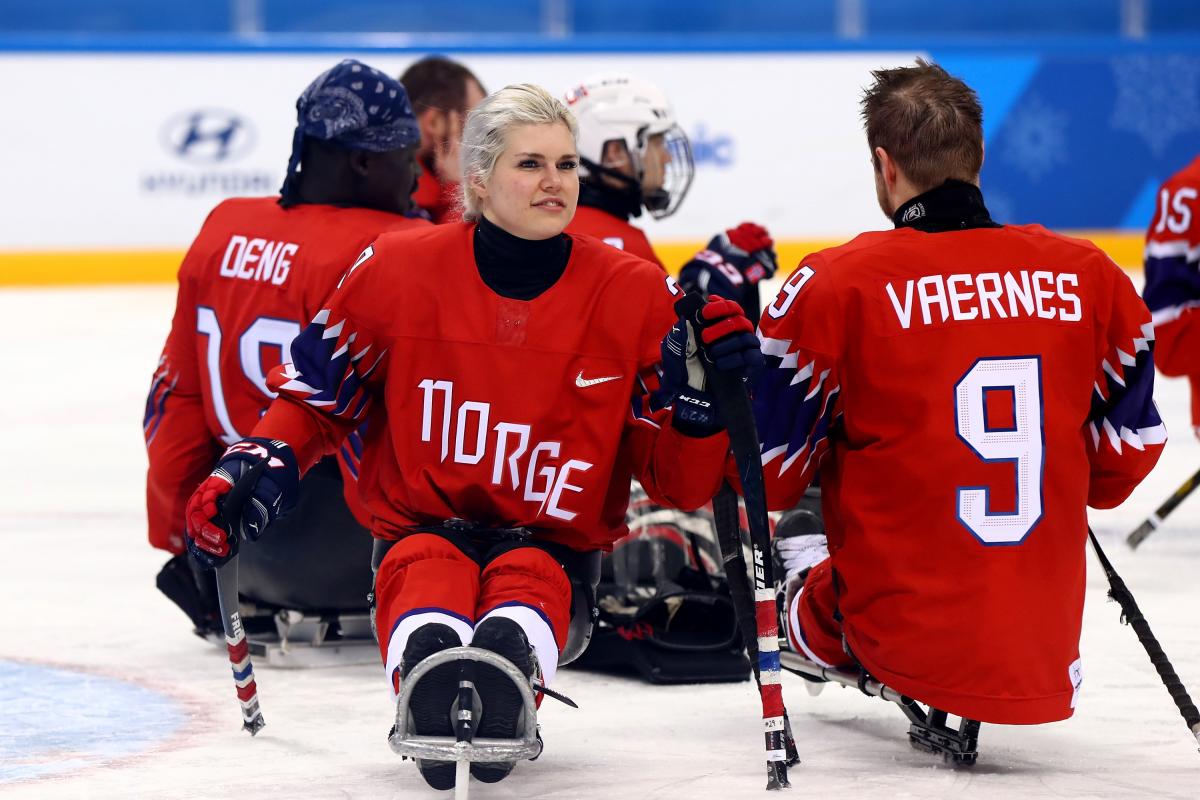 Lena Schroeder - PyeongChang 2018 a female Para ice hockey player with her teammates on the ice