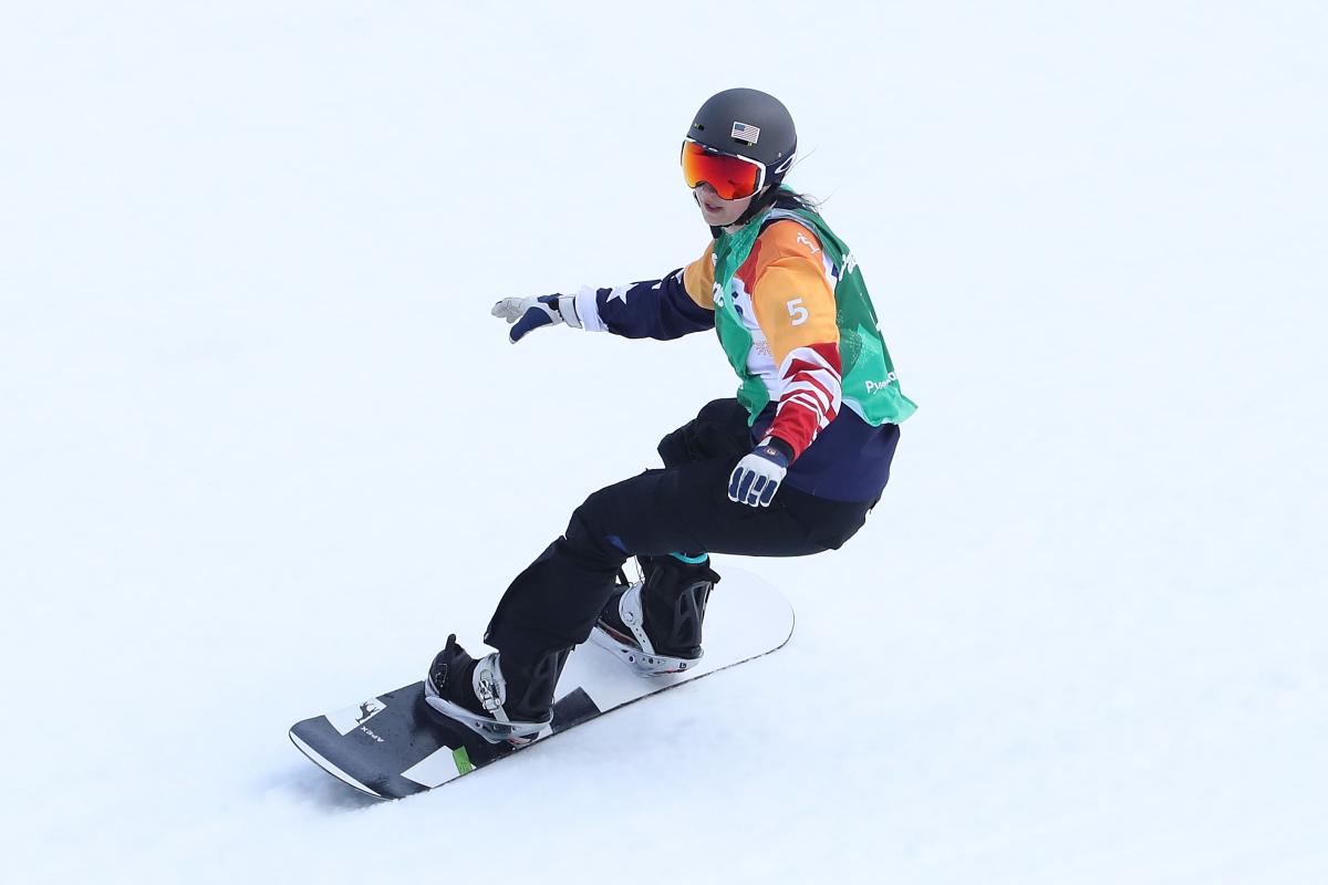 Brenna Huckaby of United States competes in the Snowboard - Women's Snowboard Cross SB-LL1 Athlete in snowboard competition