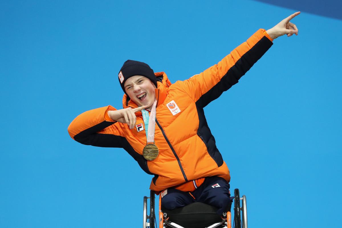 A male alpine skier on the podium