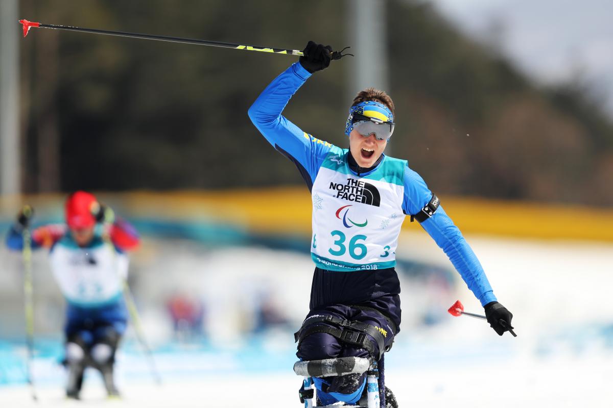 Taras Rad - PyeongChang 2018 a male Para sit skier crosses the line and celebrates
