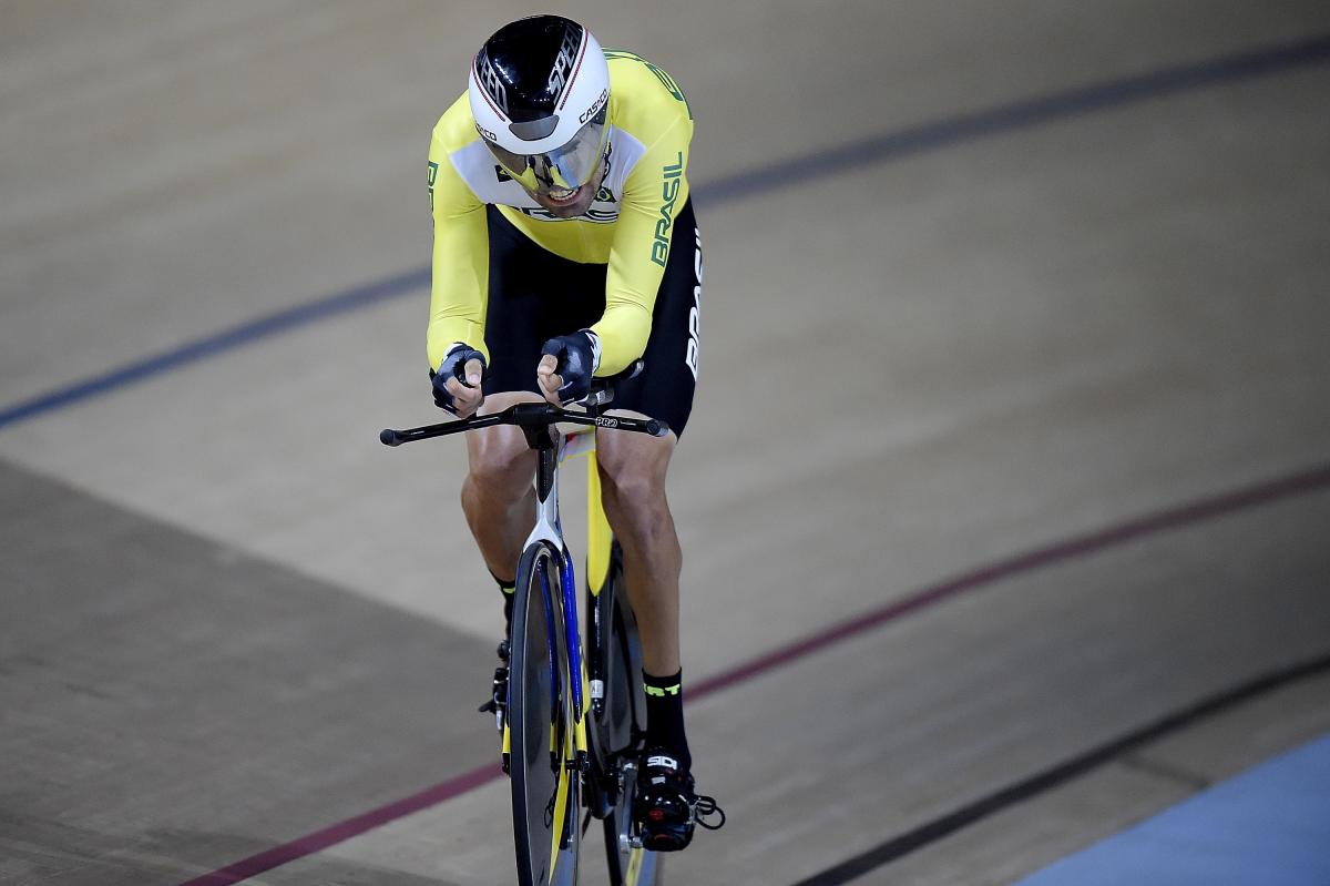 A male Para cyclist going round the track