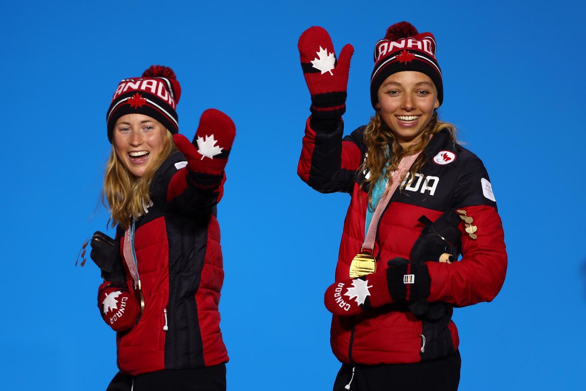 Emily Young and Natalie Wilkie - PyeongChang 2018 two female Nordic skiers wave from the podium