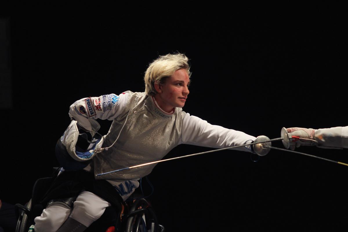 a female wheelchair fencer in action