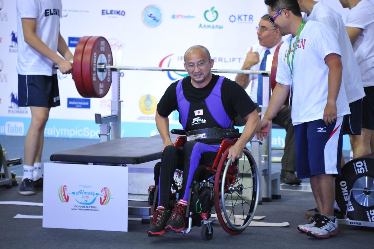 a male powerlifter on the bench