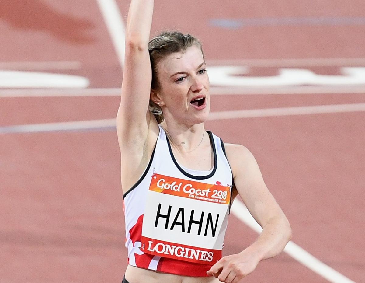 a female Para sprinter punches the air