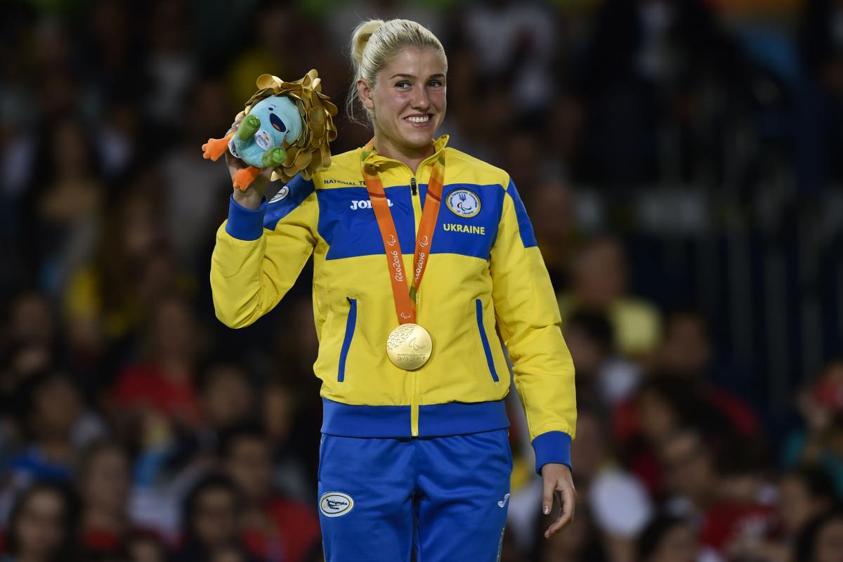 Ukrainian judoka Inna Cherniak celebrates on the podium after winning gold at Rio 2016