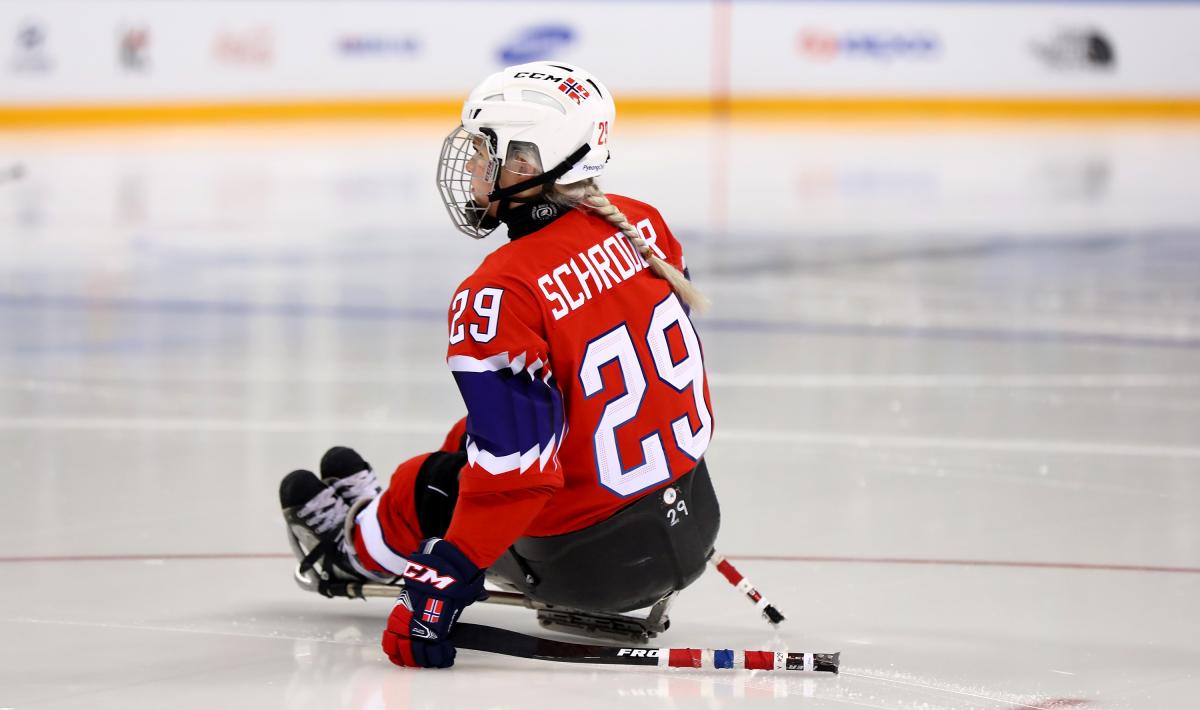 a female Para ice hockey player on the ice