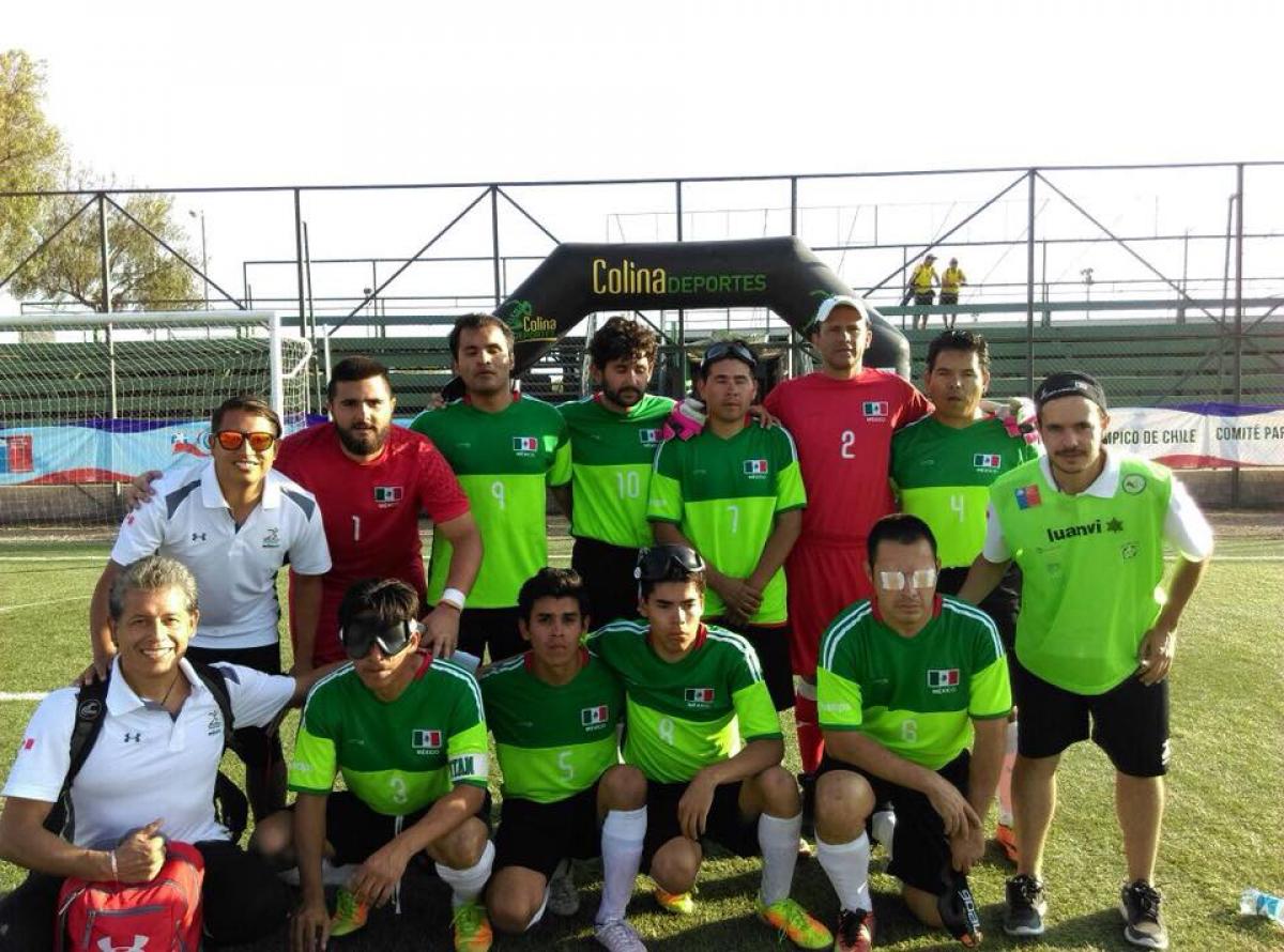 a group of blind footballers pose for a team photo