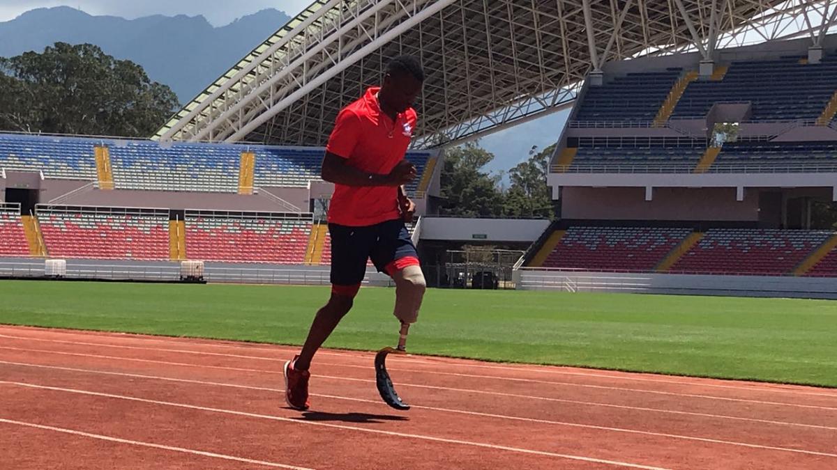 Sherman Guity a male Para athlete runs on the track
