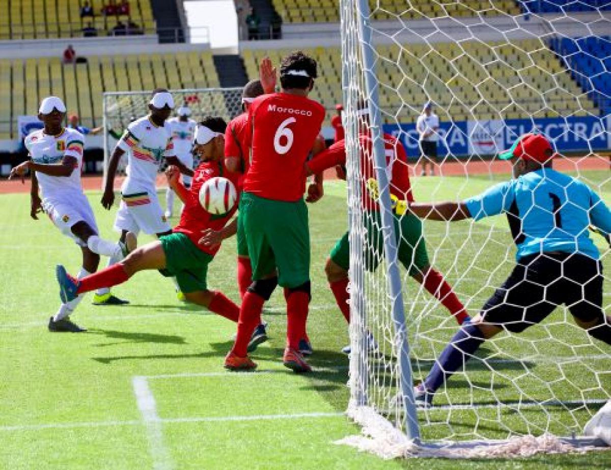 a blind footballer takes a shot